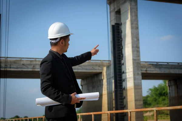 Close Asian Young Man Engineers Holding Blueprint Point Fingers Floodgates — Stock Photo, Image