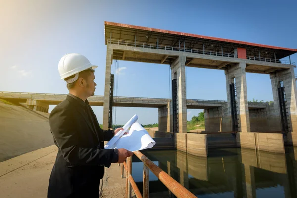 Asian Young Man Engineers Holding Blueprint Looking Floodgates Check Progress — Stock Photo, Image