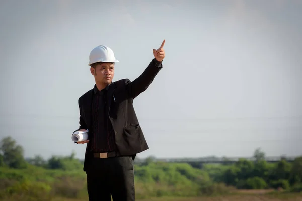Asian Young Man Engineers Holding Blueprint Point Fingers Floodgates Check — Stock Photo, Image