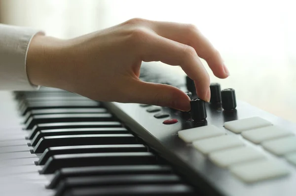 Woman Tunes Synthesizer Dressed White Shirt Side View Frame One — Stock Photo, Image