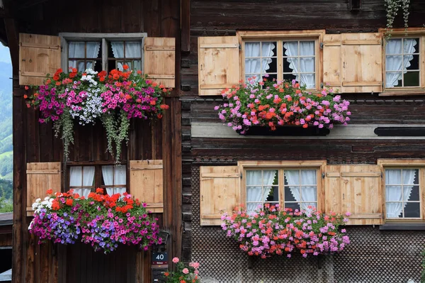 flower window,window,house,bregenzerwald,farmhouse,vorarlberg,austria,rural,building,building,flower arrangement,taditionell,wooden house,picturesque,picturesque