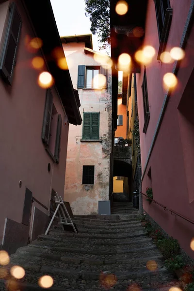 Stair with golden lights in the alleys of the old town of Varenna