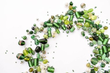 collection of green glass beads shaped into off center garland clipart