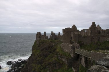 Dunluce Castle, Antrim, Northern Ireland during cloudy sky clipart