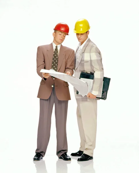 Two Architects Helmet Helmets Standing White Background — Stock Photo, Image