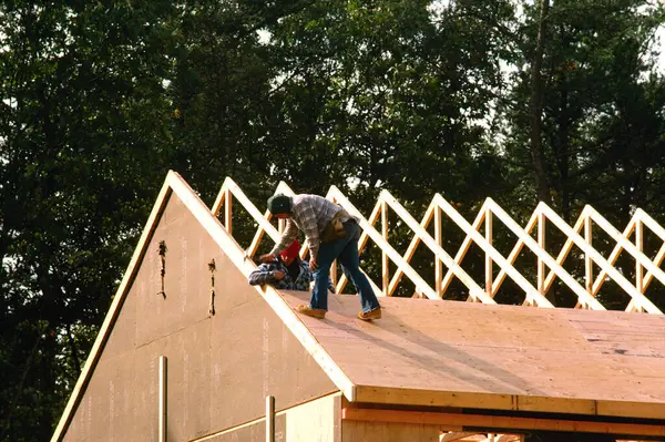 Workers putting roof on new home, Anne Arundel County, Maryland