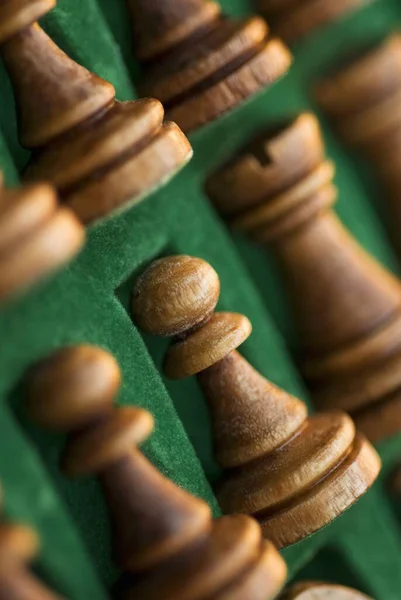 Close-up of chess pieces in a wooden box