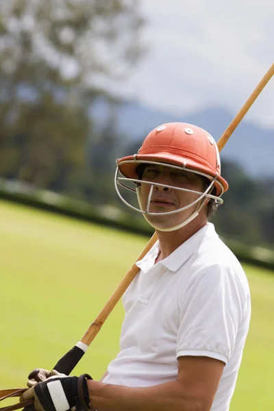 Portrait of a mature man playing polo