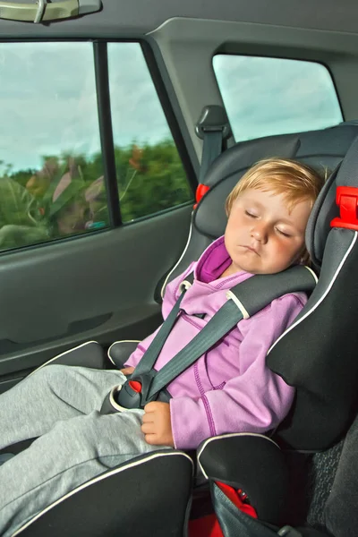 sleeping child in car seat