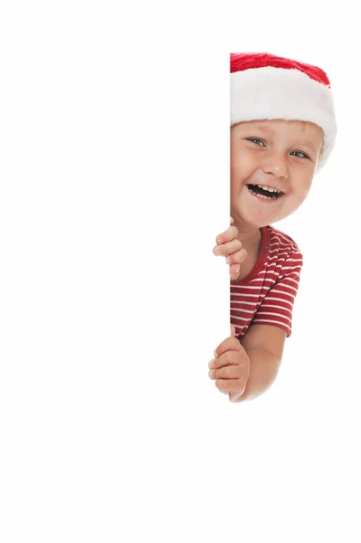 Xmasの帽子をかぶった笑顔の子供 — ストック写真