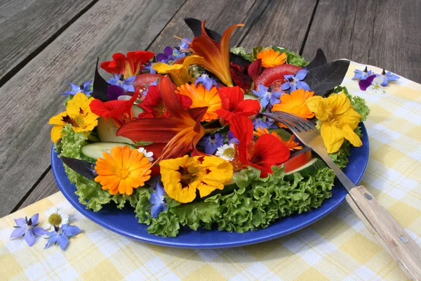 a colorful salad - mainly with edible flowers
