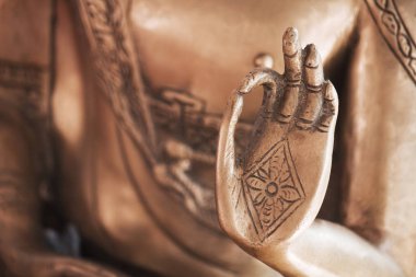the hand of the copper buddha clipart