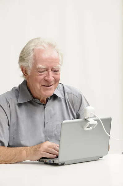 Elderly Gentleman Netbook Webcam — Stock Photo, Image