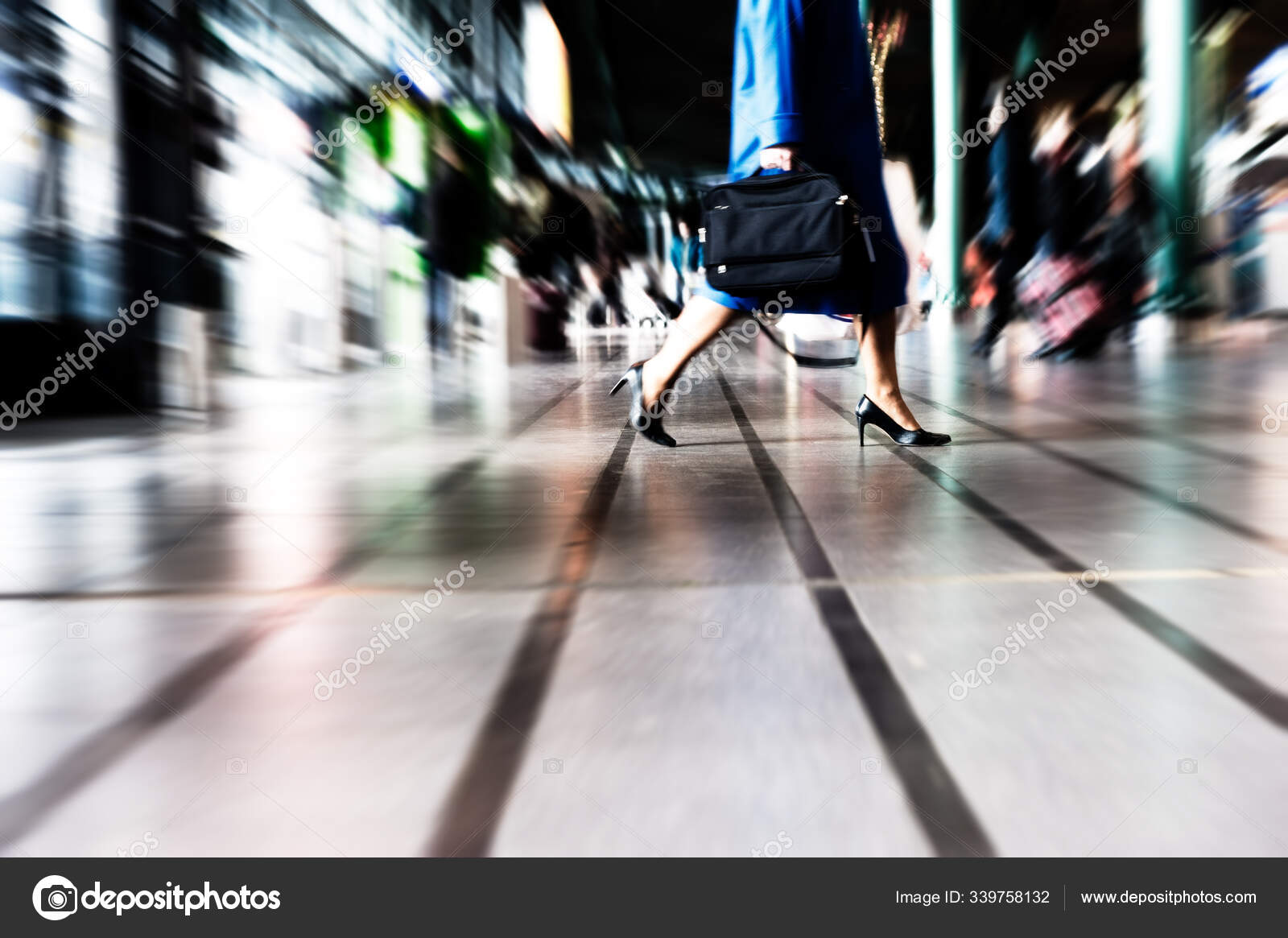 Motion blur people walking pass door of old building in rush hour  representing urban life Stock Photo - Alamy