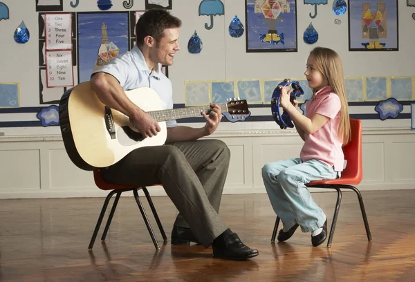 Male Teacher Playing Guitar Pupil Classroom — Stock Photo, Image