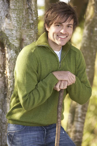 Young Man Outdoors Walking Autumn Woodland Holding Walking Stick Stock Picture