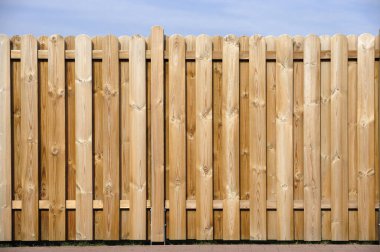 wooden fence with a blue sky clipart