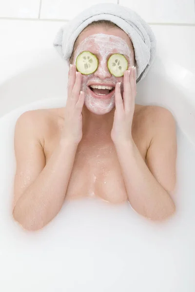 woman with cucumber mask
