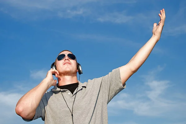 Cool Young Man Listens Music Some Headphones — Stock Photo, Image