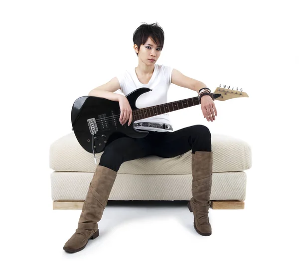 Punk Rockstar Holding Guitar Sitting Sofa Isolated White — Stock Photo, Image