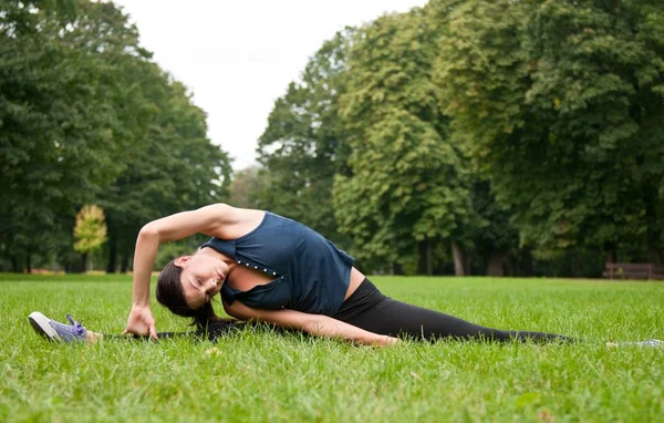 Woman stretching muscles before jogging