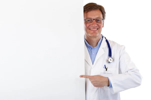 Mature Fortunate Doctor Points Finger Blank Billboard Isolated White Background — Stok fotoğraf