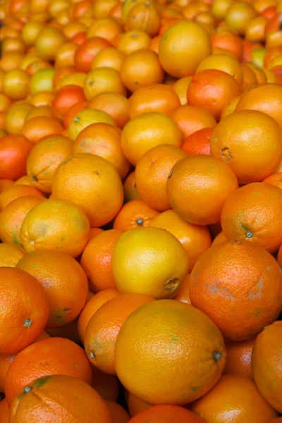 Pile of bright orange navel oranges at the farmers maket