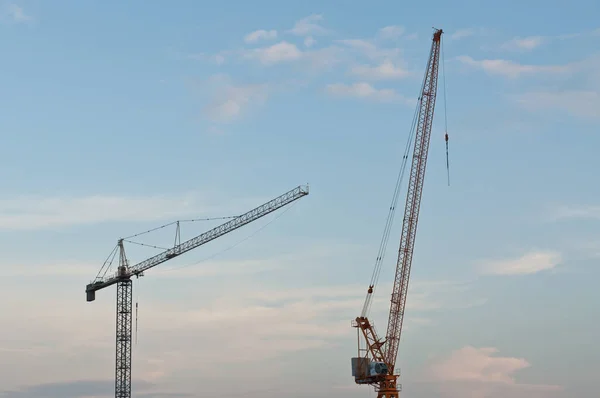Two Large Cranes Stand Blue Sky Clouds Evening — Stock Photo, Image