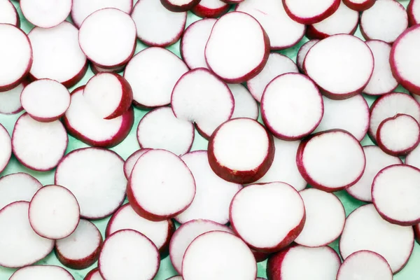 Slices Delicious Red White Vegetable Shown Light Green Background — Stock Photo, Image