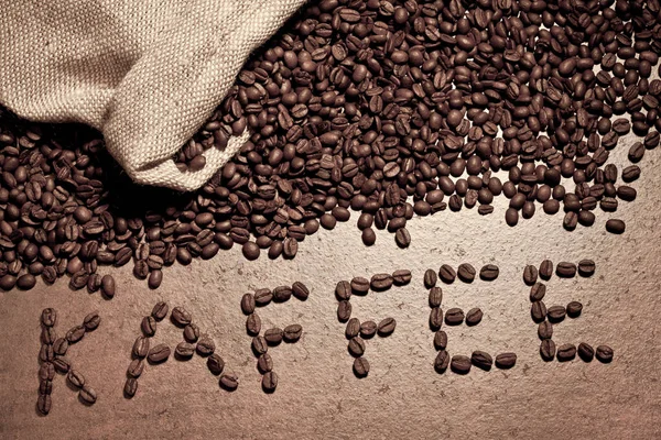 Kaffeebohnen Mit Kaffeesack Auf Dem Tisch — Stockfoto