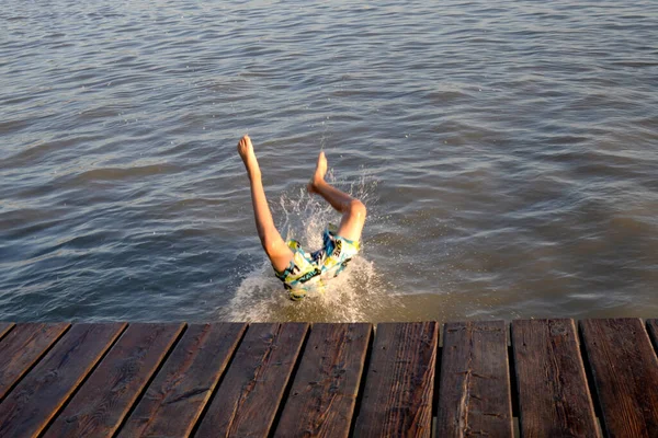 jumping into the water