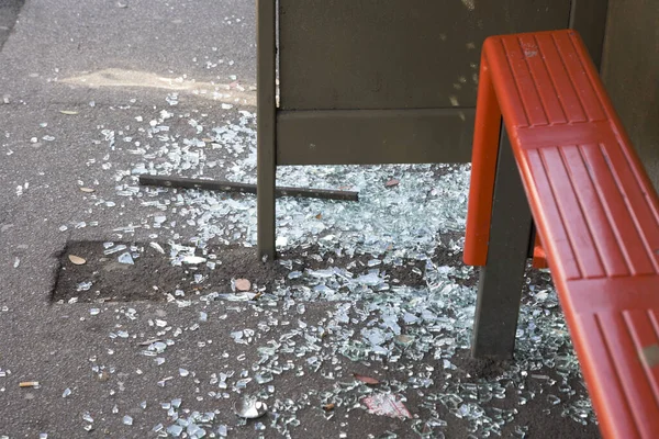 Smashed glass on a local bus stop, anti social behavior is quite on issue in the UK.