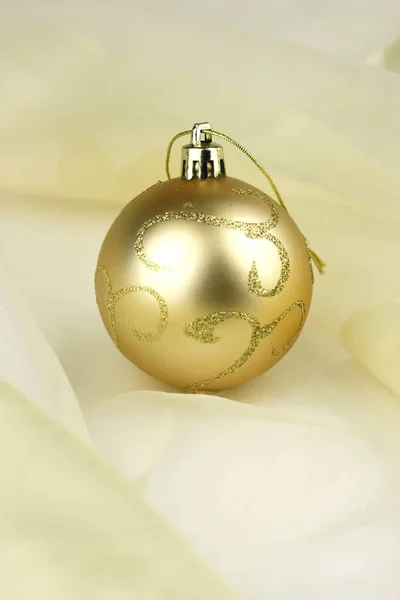 Gold Bauble Chiffon — Stock Photo, Image