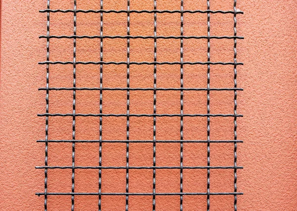 Black Wire Grid Salmon Stucco Wall — 스톡 사진