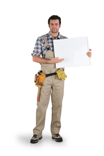 Craftsman Holding Empty Poster — Stock Photo, Image