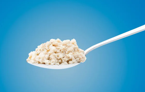 Colher Com Delicioso Mingau Cereal Fundo Azul Com Ponto Luz — Fotografia de Stock