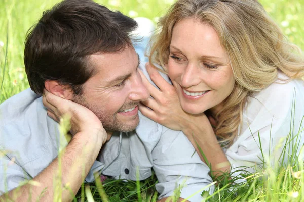 Happy Couple Lying Grass Stock Photo