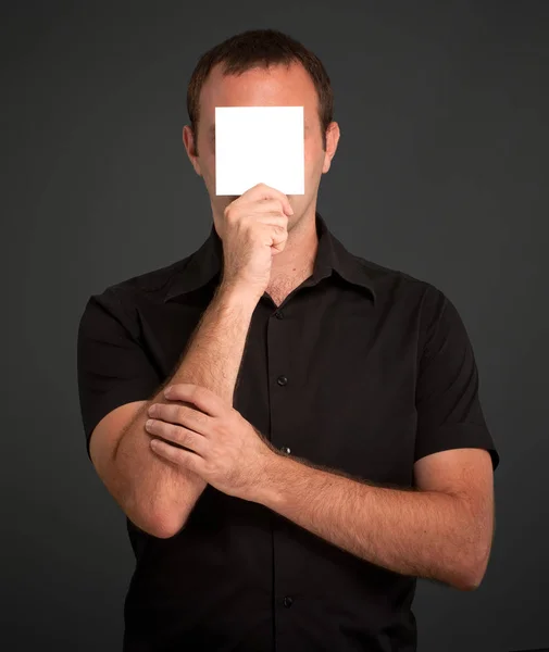 Man Holding Blank Card Black Background — Stock Photo, Image