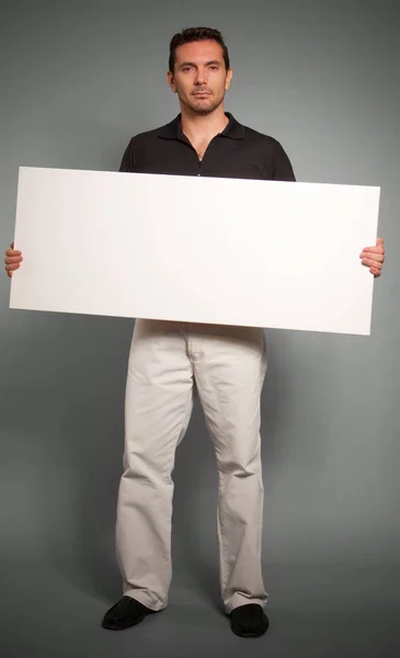 Young Handsome Businessman Holding Empty Banner — Stock Photo, Image