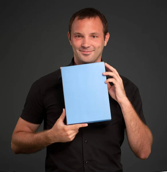 Young Man Holding Blank Card — Stock Photo, Image