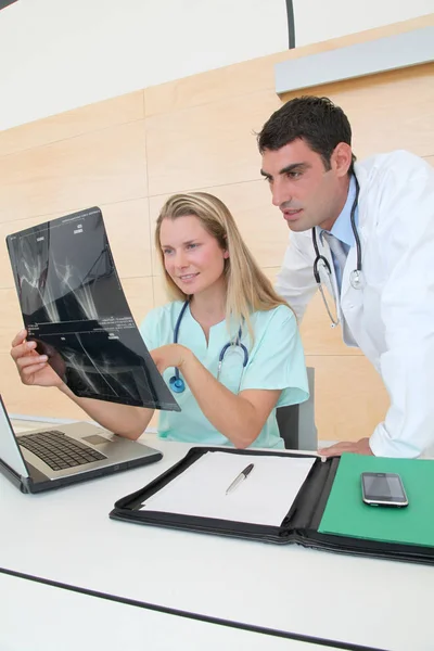 Doctor Nurse Office Checking Radiography Results Stock Picture