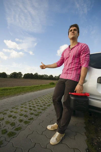 Young Man Black Jerry Cans Lonely Country Road Leaning Helplessly — Stock Photo, Image