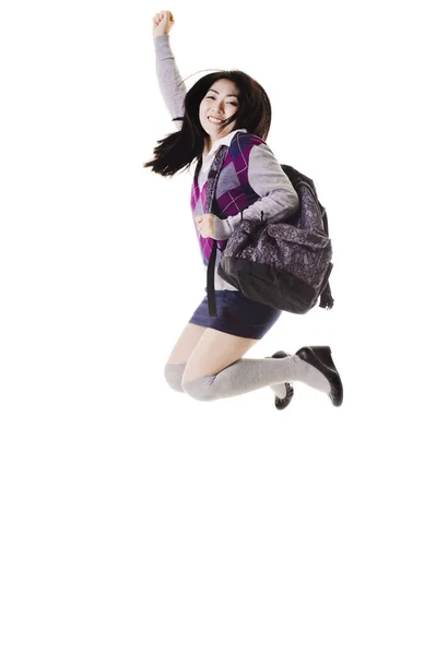 Kvinna Kinesisk Student Med Ryggsäck Vit Bakgrund Hoppar Upp Luften — Stockfoto