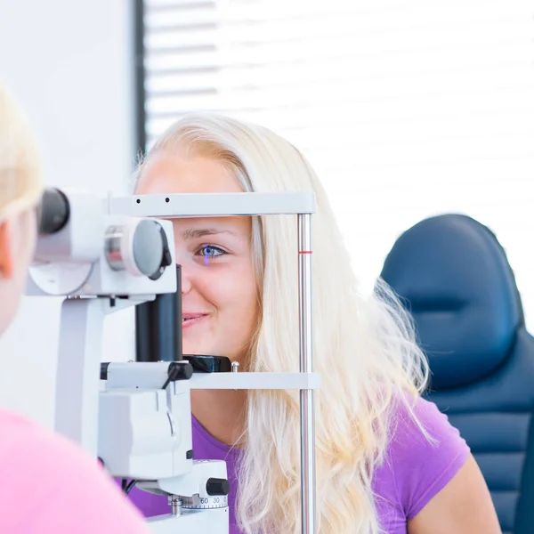 Optometry Concept Pretty Young Female Patient Having Her Eyes Examined Royalty Free Stock Images