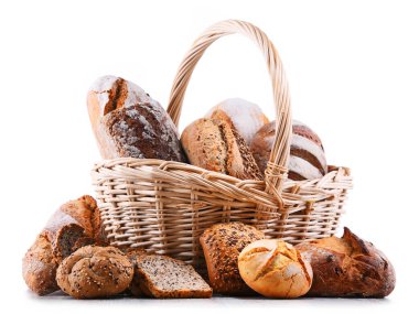 Composition with assorted bakery products in wicker basket isolated on white clipart