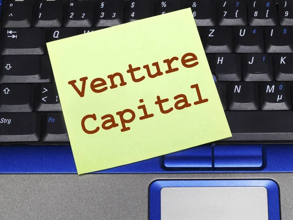 Memo note on notebook, venture capital