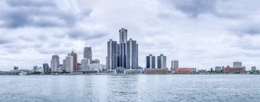 Offices of the automotive industry on the banks of the Detroit River. A group of towering buildings is General Motors. clipart