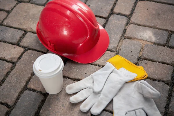 Red Helmet Coffee Mug Work Gloves Stones — Stock Photo, Image