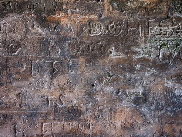 Gravierte Schriften Auf Steinmauer — Stockfoto