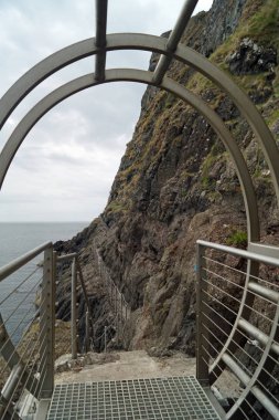 The Gobbins is a cliff path in Islandmagee, County Antrim, Northern Ireland, on the Causeway Coastal Route. It passes over bridges, past caves and through a tunnel along the Gobbins Cliffs. clipart